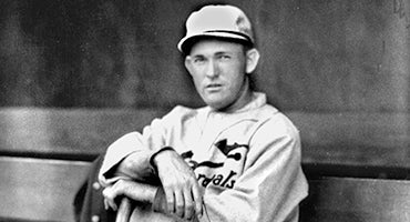 Rogers Hornsby seated in dugout