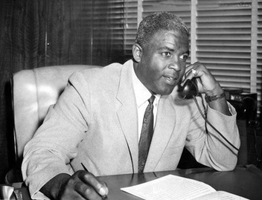 Jackie Robinson speaking on the phone.